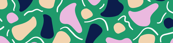 An original Two + Lou abstract print design in jade green, pink, cream and white.